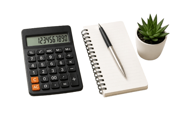 Calculator, notebook and plant on a desk